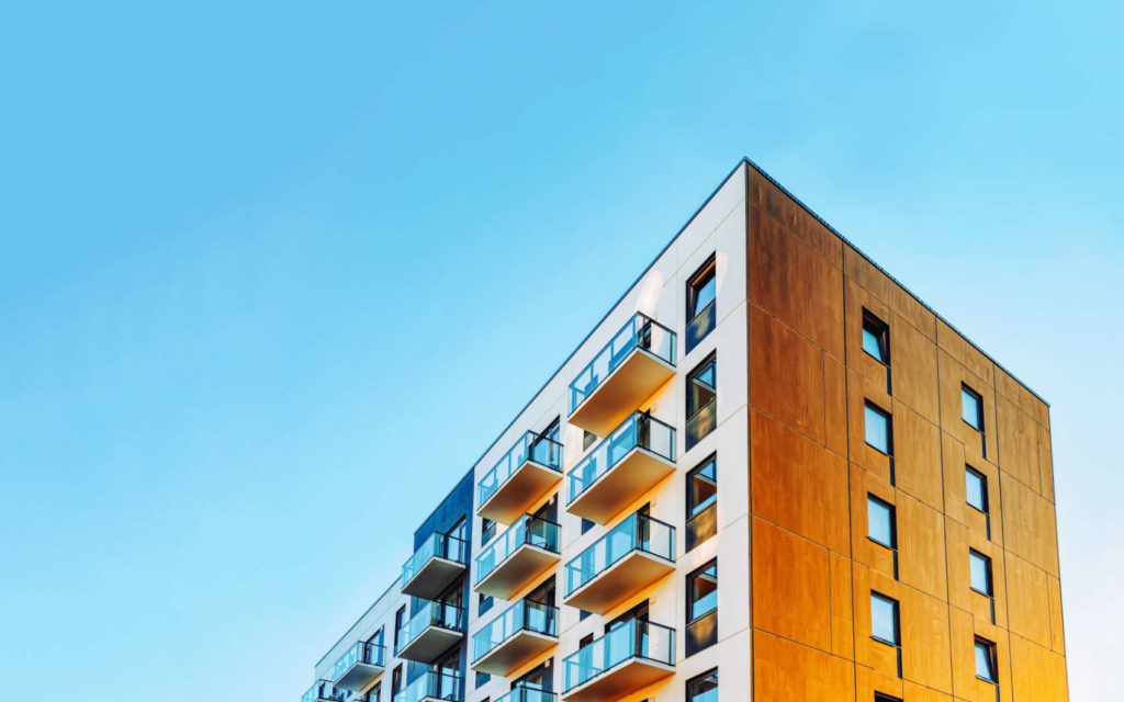 Part of Modern residential apartment with flat building exterior.